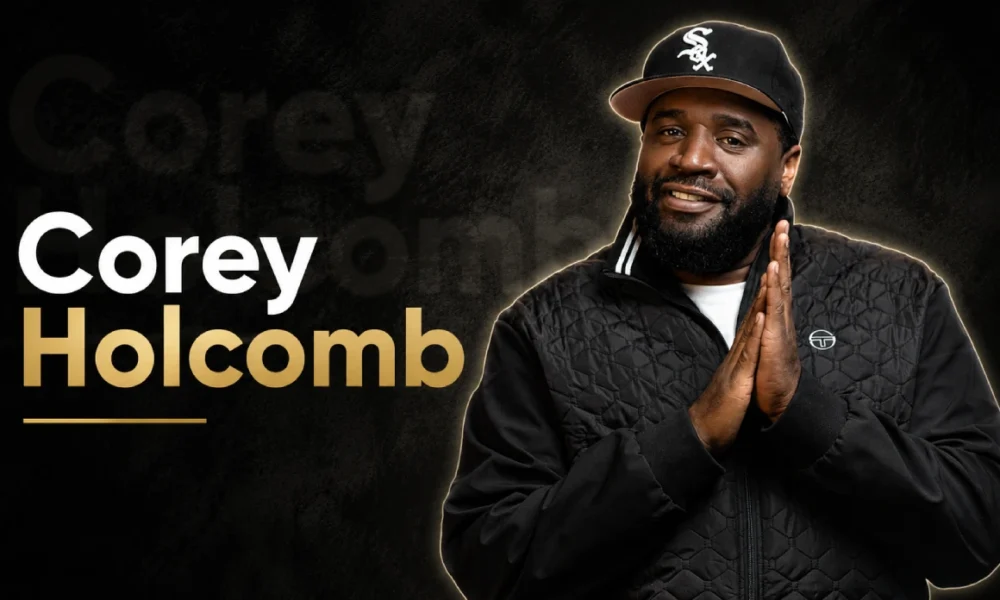 Corey Holcomb smiling during a studio photoshoot.