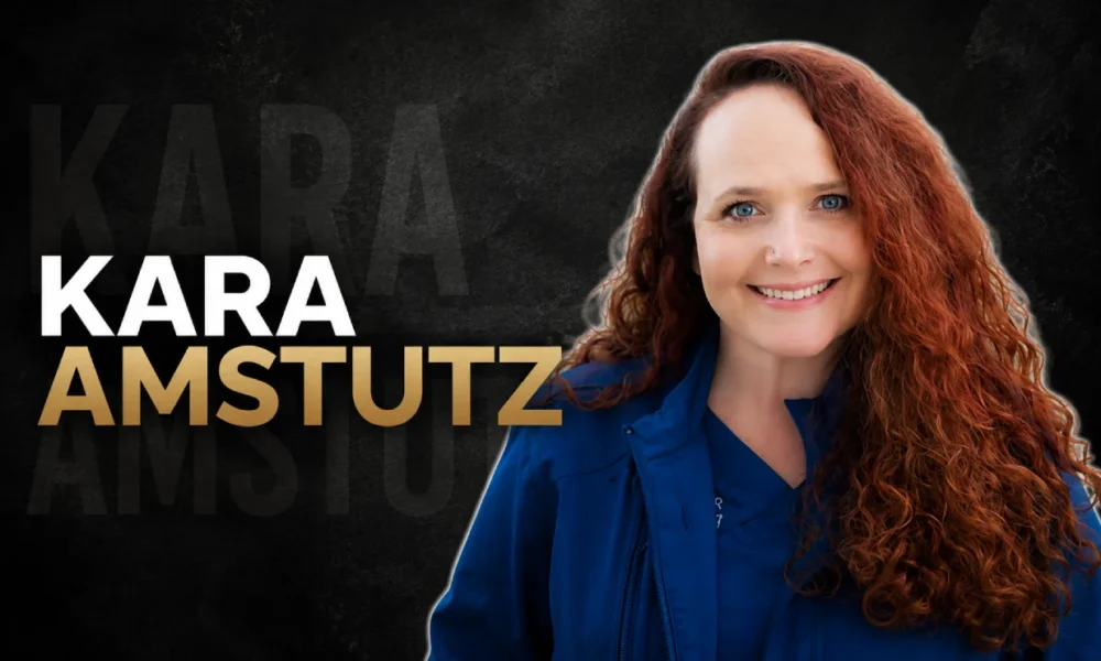 Kara Amstutz smiling in professional veterinary attire