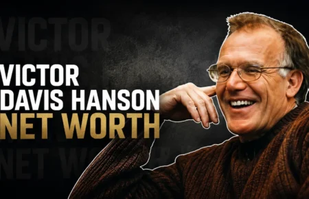 Victor Davis Hanson smiling in a brown sweater