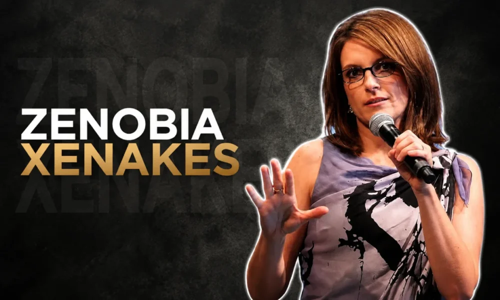 Zenobia Xenakes speaking on stage with a microphone