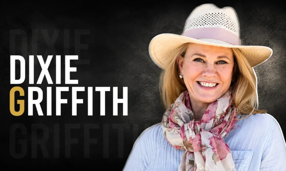 Dixie Griffith smiling in a hat and scarf