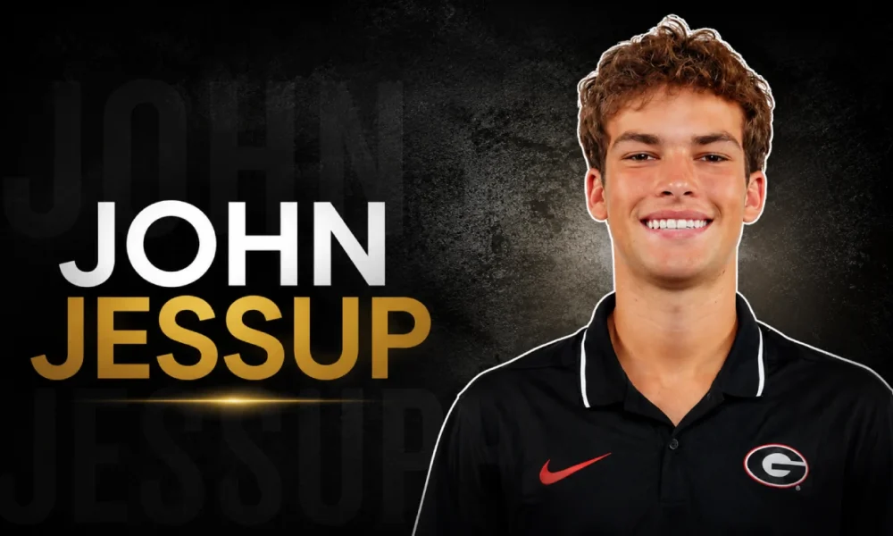 John Jessup smiling during a professional headshot associated with his broadcasting career.