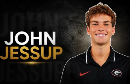 John Jessup smiling during a professional headshot associated with his broadcasting career.