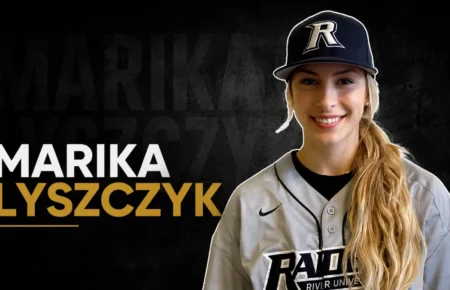 Marika Lyszczyk wearing a River University baseball uniform