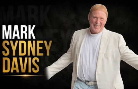 Mark Sydney Davis, the adopted son of Sammy Davis Jr., smiling in a light-colored outfit.