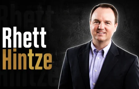 Rhett Hintze, business executive associated with StateSource, smiling in professional attire.
