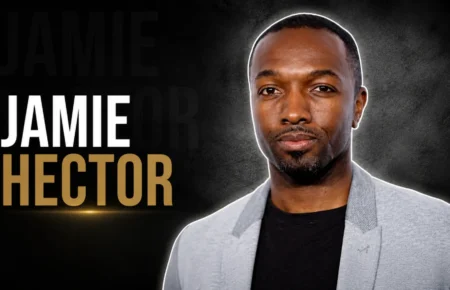 Jamie Hector in a light gray blazer