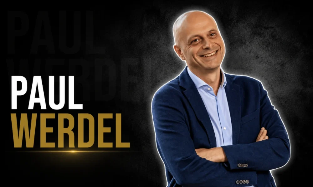 Paul Werdel smiling in a navy blazer
