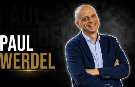 Paul Werdel smiling in a navy blazer