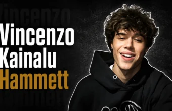 Vincenzo Kainalu Hammett, son of musician Kirk Hammett, smiling in a casual black hoodie.